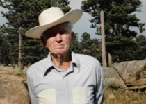 Photo of Colonel William C  Rogers wearing white flat-brimmed cowboy hat
