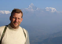 Michael Urynowicz portrait with mountains in the background 